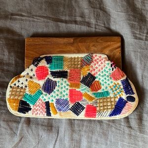 Lovestitch embroidered clutch with wooden handle
